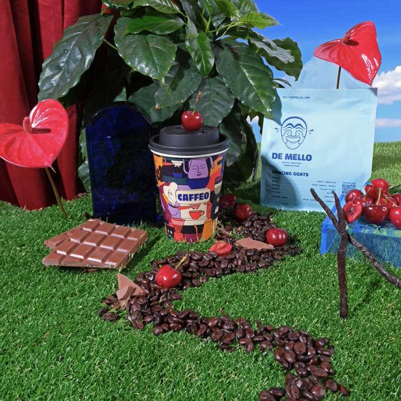 A Caffeo cup with De Mello beans, chocolate and cherries showing its tasting notes